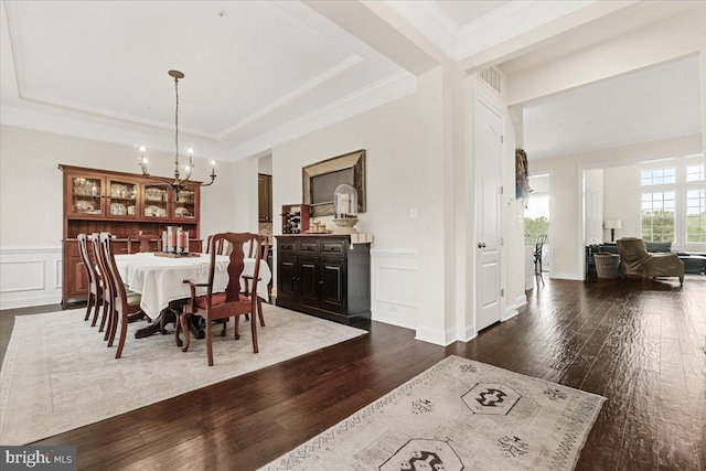 3525 Franks Ter, Monrovia, MD 21770 - dining space with dark wood-style flooring, a decorative wall, a chandelier, wainscoting, and ornamental molding