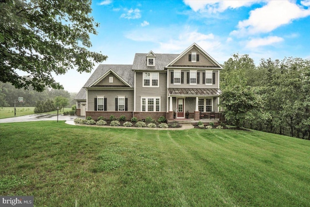 3525 Franks Ter, Monrovia, MD 21770 - view of front of home with brick siding, covered porch, a front yard, and concrete driveway