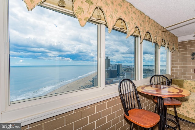 10300 Coastal Hwy Unit 1905, Ocean City, MD 21842 - sunroom with a textured ceiling and a water view