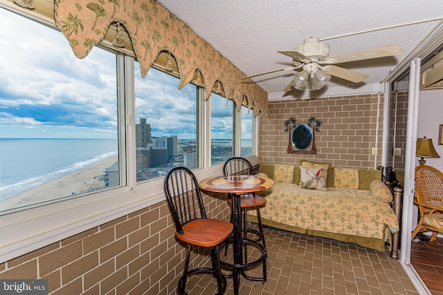 10300 Coastal Hwy Unit 1905, Ocean City, MD 21842 - sunroom / solarium with a ceiling fan, healthy amount of natural light, and a water view