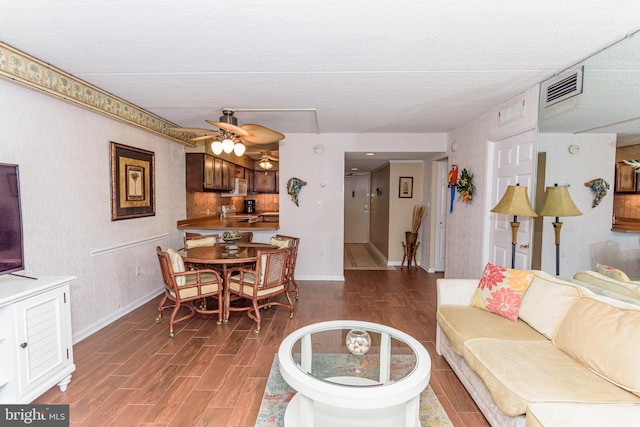 10300 Coastal Hwy Unit 1905, Ocean City, MD 21842 - living area with baseboards, ceiling fan, wood finished floors, and a textured ceiling