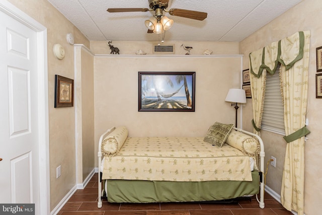 10300 Coastal Hwy Unit 1905, Ocean City, MD 21842 - bedroom featuring a textured ceiling, wood tiled floors, ceiling fan, and baseboards
