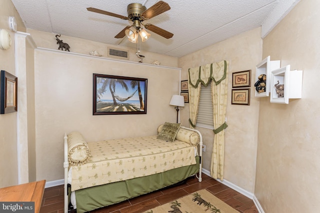 10300 Coastal Hwy Unit 1905, Ocean City, MD 21842 - bedroom featuring wood tiled floors, a ceiling fan, a textured ceiling, and baseboards