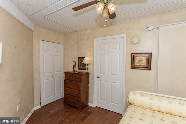 10300 Coastal Hwy Unit 1905, Ocean City, MD 21842 - living area featuring dark wood-type flooring, a ceiling fan, baseboards, and a textured ceiling