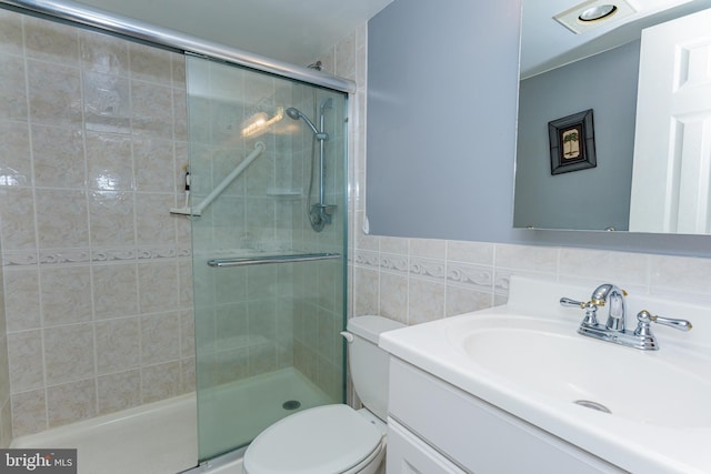 10300 Coastal Hwy Unit 1905, Ocean City, MD 21842 - full bathroom featuring vanity, tiled shower, toilet, and tile walls