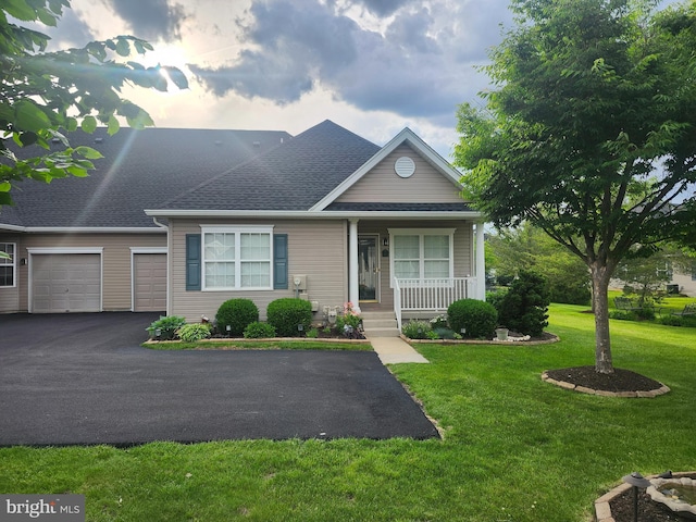 45 Freedom Ln, Bensalem, PA 19020 - view of front of property featuring a porch, an attached garage, driveway, a front yard, and a shingled roof