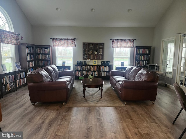 45 Freedom Ln, Bensalem, PA 19020 - living room with plenty of natural light, wood finished floors, wall of books, and high vaulted ceiling