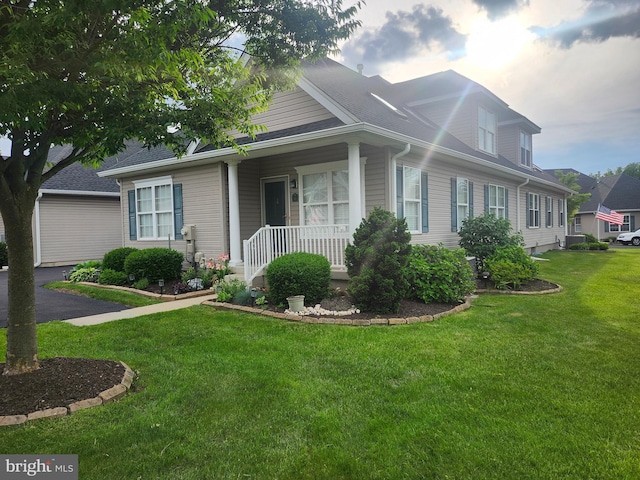 45 Freedom Ln, Bensalem, PA 19020 - view of front of property featuring a front lawn, a shingled roof, and a porch