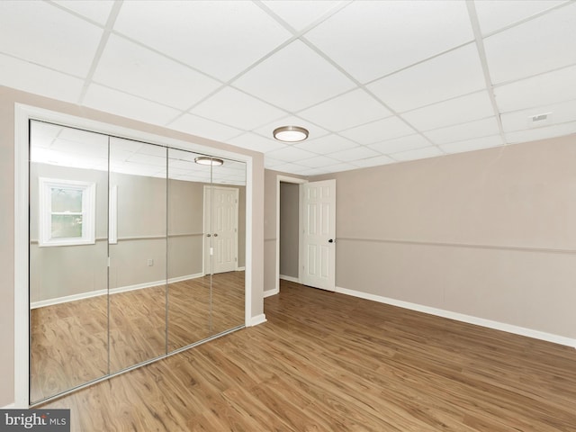 1707 Hall Ave, Baltimore, MD 21227 - unfurnished bedroom featuring a paneled ceiling, wood finished floors, and a closet