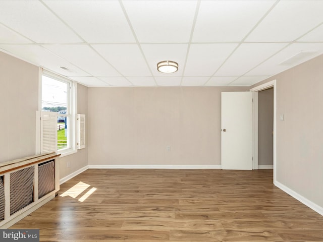 1707 Hall Ave, Baltimore, MD 21227 - spare room with a drop ceiling and wood finished floors