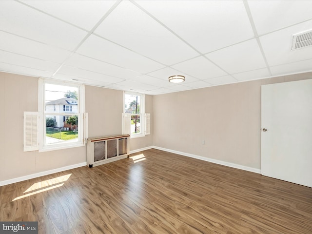 1707 Hall Ave, Baltimore, MD 21227 - unfurnished room featuring wood finished floors and a paneled ceiling