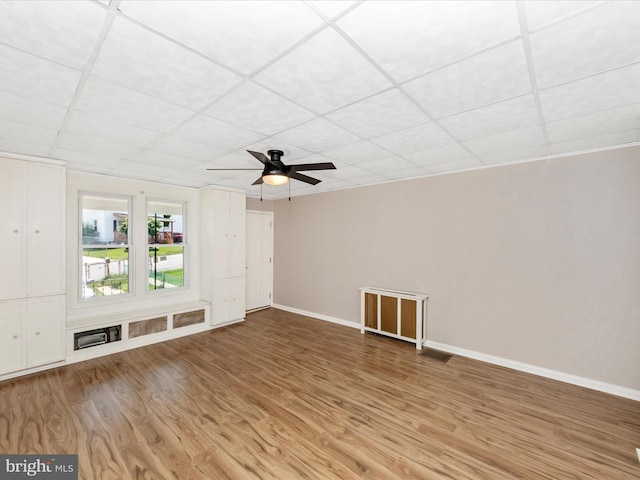 1707 Hall Ave, Baltimore, MD 21227 - spare room featuring light wood-type flooring, a ceiling fan, and a drop ceiling
