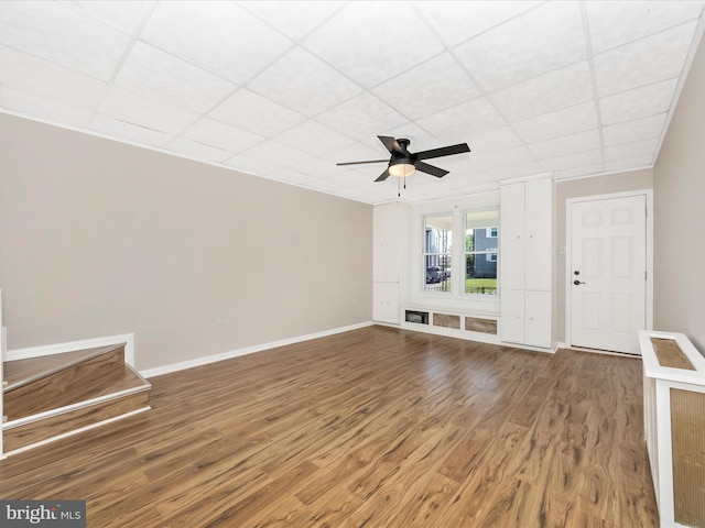 1707 Hall Ave, Baltimore, MD 21227 - unfurnished living room with a ceiling fan, wood finished floors, and a drop ceiling