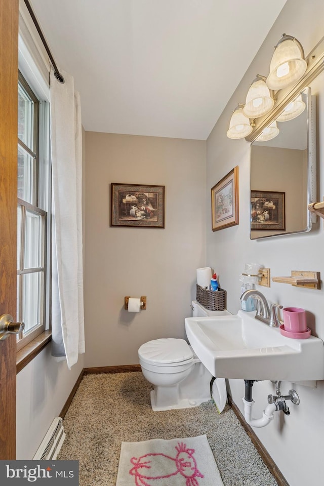 14 Yorkshire Rd, Hamilton, NJ 08610 - half bath featuring toilet, baseboards, plenty of natural light, and baseboard heating