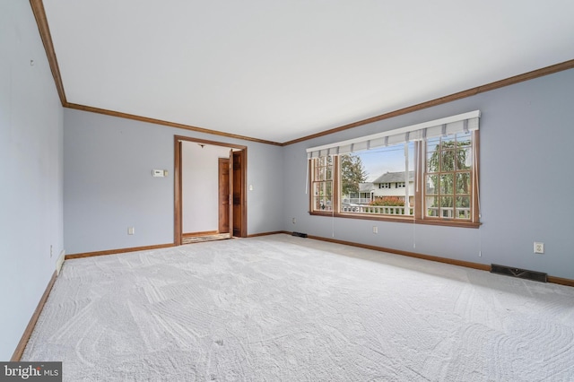 14 Yorkshire Rd, Hamilton, NJ 08610 - spare room with crown molding, baseboards, and light carpet