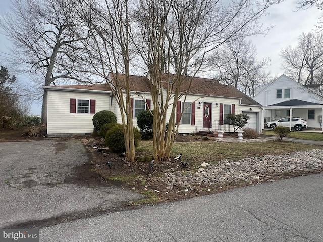 5227 Al Jones Dr, Shady Side, MD 20764 - view of front facade featuring driveway, a garage, and crawl space