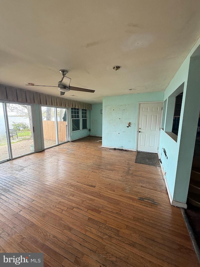 5227 Al Jones Dr, Shady Side, MD 20764 - unfurnished living room featuring wood-type flooring and a ceiling fan