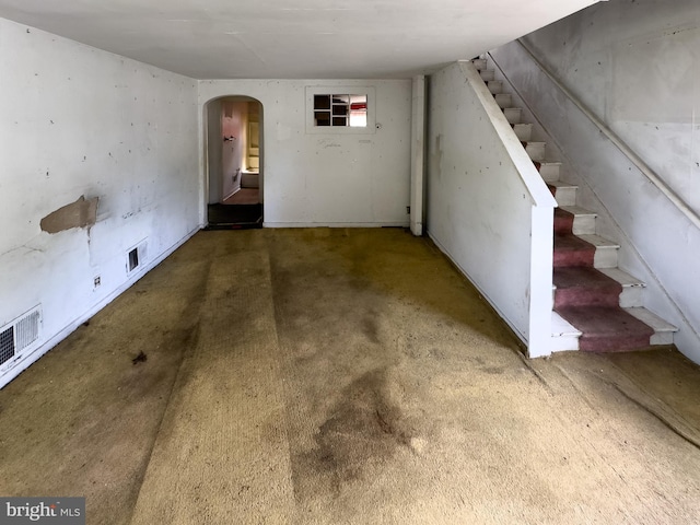 1228 Pacific Ave, Bristol, PA 19007 - unfurnished living room with arched walkways and stairs