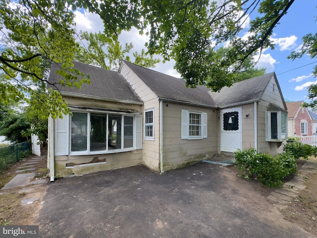 1228 Pacific Ave, Bristol, PA 19007 - view of front of house featuring a patio area and a shingled roof