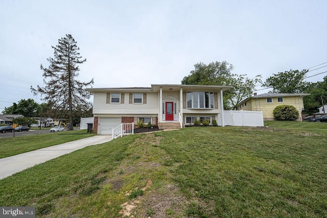 29 Holyoke Dr, Delran, NJ 08075 - bi-level home with concrete driveway, an attached garage, and brick siding