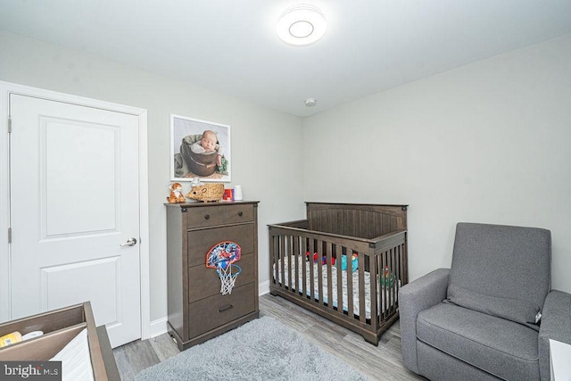 29 Holyoke Dr, Delran, NJ 08075 - bedroom featuring wood finished floors, baseboards, and a nursery area