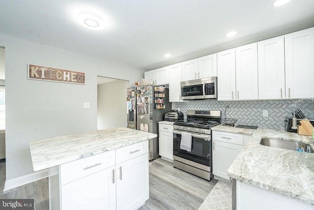 29 Holyoke Dr, Delran, NJ 08075 - kitchen featuring stainless steel appliances, a sink, light wood-style flooring, white cabinetry, and recessed lighting