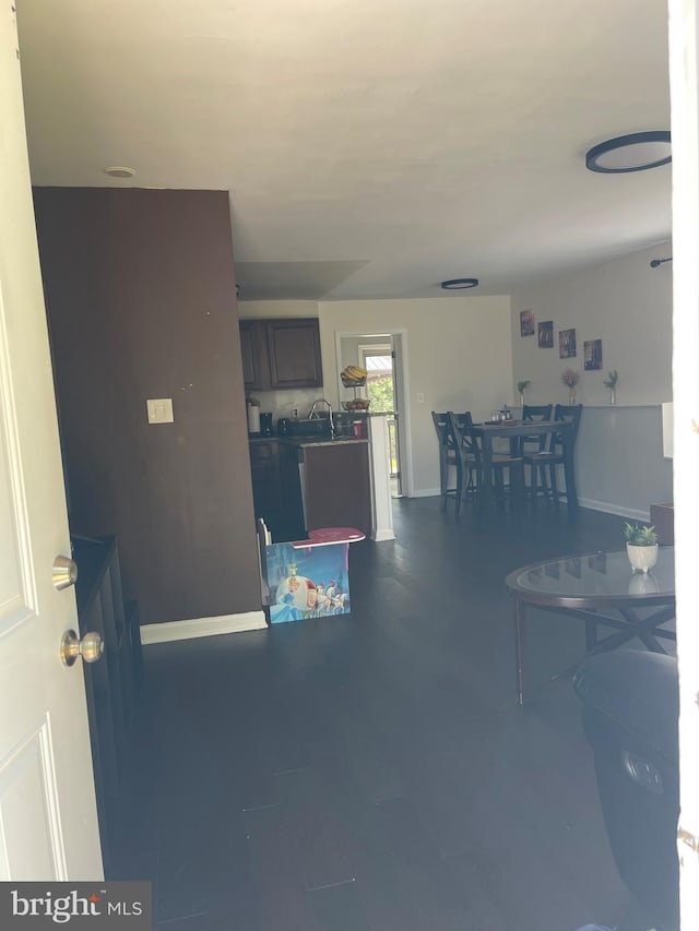 1604 Manning Rd, Glen Burnie, MD 21061 - living area featuring baseboards and dark wood-type flooring