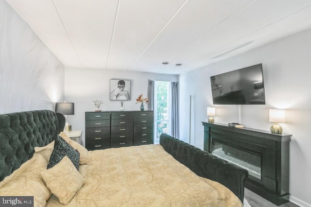 2622 Wagon Dr Unit 319, Alexandria, VA 22303 - bedroom with a glass covered fireplace