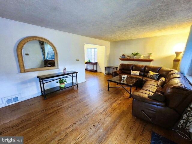 6029 Amherst Ave, Springfield, VA 22150 - living area with wood-type flooring and a textured ceiling