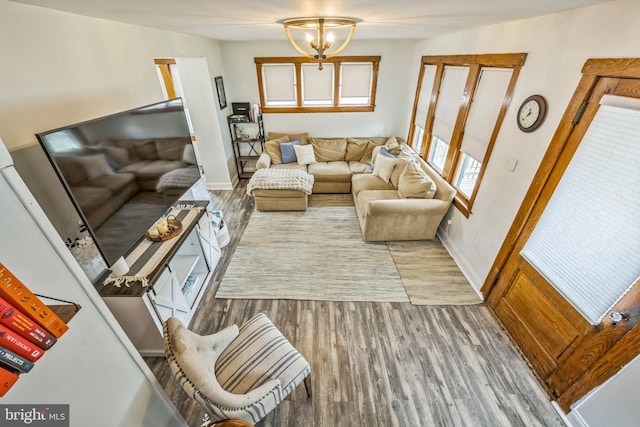 122 E Pine St, Audubon, NJ 08106 - living room featuring wood finished floors, a chandelier, and baseboards