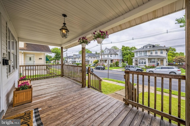 122 E Pine St, Audubon, NJ 08106 - wooden porch with a residential view and a yard