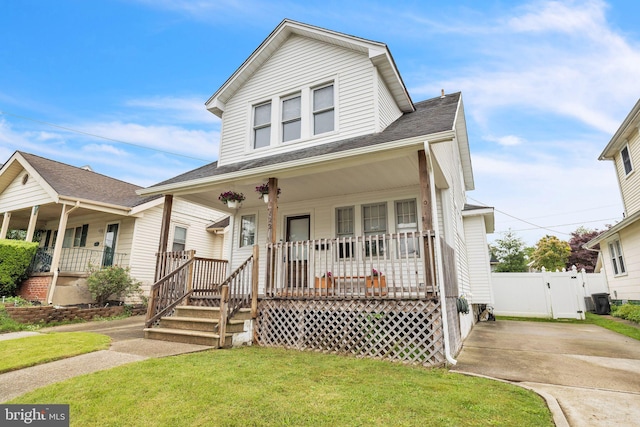 122 E Pine St, Audubon, NJ 08106 - view of front of house with covered porch, roof with shingles, and a gate