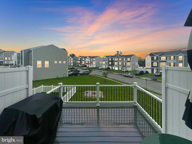 144 Overlook Dr, Hanover, PA 17331 - deck at dusk featuring a residential view and a lawn