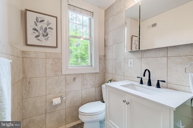 1858 California St NW Unit 20, Washington, DC 20009 - half bath featuring tile walls, toilet, and vanity