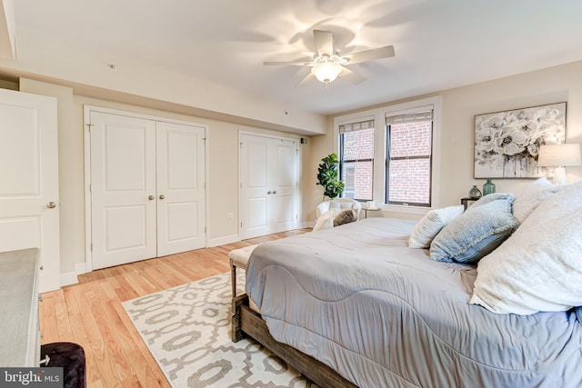 1858 California St NW Unit 20, Washington, DC 20009 - bedroom with multiple closets, wood finished floors, a ceiling fan, and baseboards