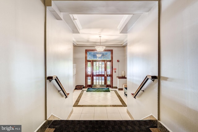 1858 California St NW Unit 20, Washington, DC 20009 - foyer with tile patterned flooring, crown molding, a chandelier, and baseboards