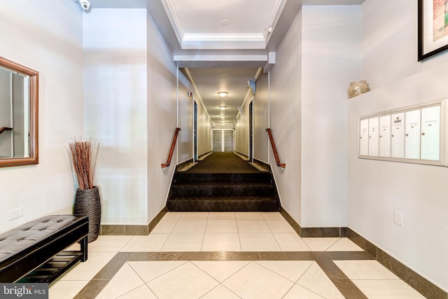 1858 California St NW Unit 20, Washington, DC 20009 - stairs with tile patterned flooring, mail area, inlaid floor details, ornamental molding, and baseboards