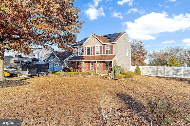 1 Winterberry Pl, Clayton, NJ 08312 - view of front of home featuring roof mounted solar panels and brick siding