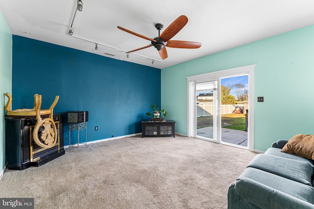 1 Winterberry Pl, Clayton, NJ 08312 - carpeted living area with track lighting, ceiling fan, and baseboards