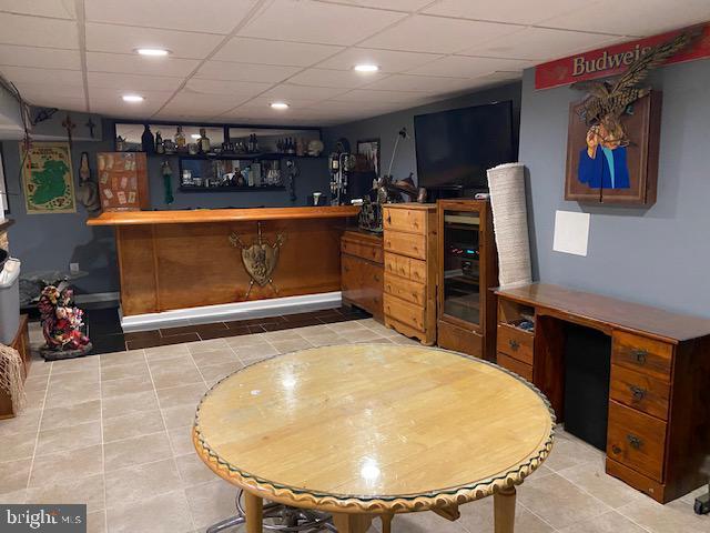 1 Winterberry Pl, Clayton, NJ 08312 - indoor dry bar featuring tile patterned floors, a paneled ceiling, and recessed lighting