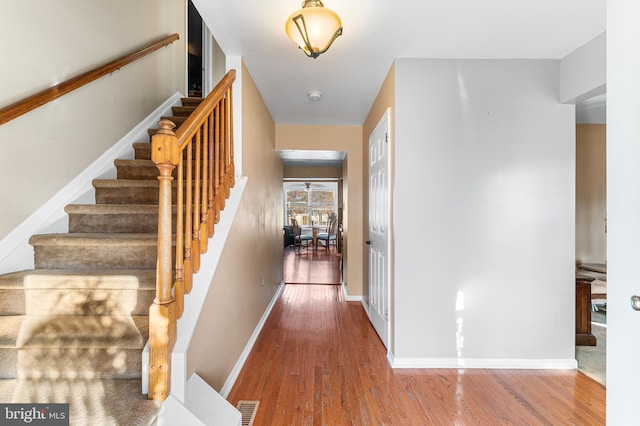 1 Winterberry Pl, Clayton, NJ 08312 - hall featuring wood finished floors, stairway, and baseboards