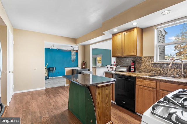 1 Winterberry Pl, Clayton, NJ 08312 - kitchen featuring dishwasher, a sink, a kitchen island, wood finished floors, and decorative backsplash