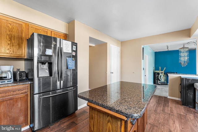 1 Winterberry Pl, Clayton, NJ 08312 - kitchen with stainless steel refrigerator with ice dispenser, brown cabinets, dark wood-style floors, and dark stone countertops