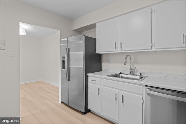 45104 Delaire Landing Rd Unit 104, Philadelphia, PA 19114 - kitchen with appliances with stainless steel finishes, a sink, light countertops, and light wood-style flooring