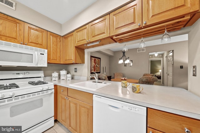 605A Ralston Dr Unit A, Mount Laurel, NJ 08054 - kitchen with white appliances, a sink, light countertops, a chandelier, and hanging light fixtures
