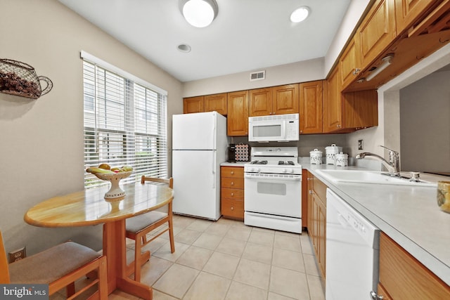 605A Ralston Dr Unit A, Mount Laurel, NJ 08054 - kitchen with white appliances, a sink, light countertops, light tile patterned floors, and brown cabinetry