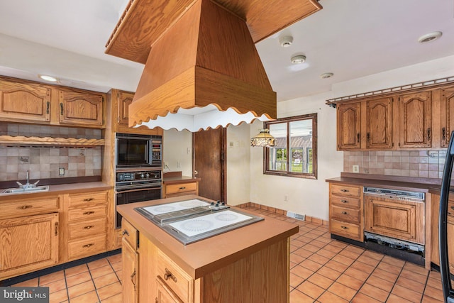 1685 E Willow Grove Ave, Glenside, PA 19038 - kitchen featuring black appliances, a sink, light tile patterned flooring, and tasteful backsplash