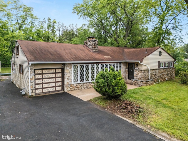1685 E Willow Grove Ave, Glenside, PA 19038 - view of front of home with stone siding, an attached garage, a chimney, driveway, and a shingled roof