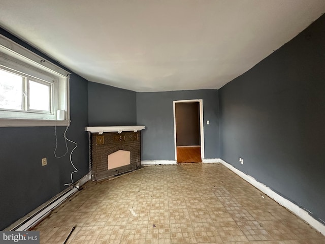 1318 E Luzerne St, Philadelphia, PA 19124 - unfurnished living room featuring tile patterned floors, a fireplace, baseboards, and baseboard heating