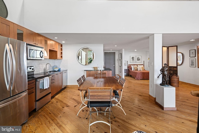 3132 E Thompson St Unit 2C, Philadelphia, PA 19134 - dining area featuring light wood finished floors and recessed lighting
